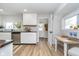 Stylish kitchen with white cabinets, wood countertops, stainless steel appliances and a small dining table at 702 S Fanning St, Sheridan, IN 46069