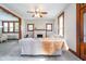 Spacious living room showcasing wood trim, fireplace, and dining area at 702 S Fanning St, Sheridan, IN 46069