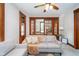 Comfortable living room with wood trim, glass-paneled doors, and soft lighting at 702 S Fanning St, Sheridan, IN 46069