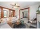 Inviting living room with wood trim, fireplace, and staircase view at 702 S Fanning St, Sheridan, IN 46069