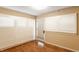 Bedroom with hardwood floors, neutral walls, and white shuttered windows at 7023 Steinmeier W Dr, Indianapolis, IN 46220