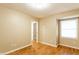 Bedroom with hardwood floors, light neutral walls, and a window at 7023 Steinmeier W Dr, Indianapolis, IN 46220