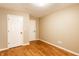 Bedroom with hardwood floors and neutral walls at 7023 Steinmeier W Dr, Indianapolis, IN 46220