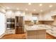 Modern kitchen with stainless steel appliances, white cabinets, granite countertops, and a kitchen island at 7023 Steinmeier W Dr, Indianapolis, IN 46220