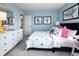 Colorful bedroom with polka dot bedding, bright accent pillows and light blue walls at 7313 Deerberg Dr, Indianapolis, IN 46259