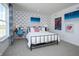 Stylized bedroom featuring a metal frame bed, accent wall, and brightly colored decorative artwork at 7313 Deerberg Dr, Indianapolis, IN 46259