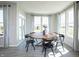 Breakfast nook featuring a wooden table, black chairs, large windows, and natural light at 7313 Deerberg Dr, Indianapolis, IN 46259