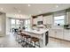 Spacious kitchen featuring a large center island with seating, stainless appliances, and an adjacent dining area at 7313 Deerberg Dr, Indianapolis, IN 46259