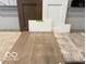 Selection of interior finishes, including flooring, cabinetry, countertop materials, and color samples at 7313 Deerberg Dr, Indianapolis, IN 46259