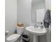 Small half bathroom featuring a pedestal sink and classic fixtures at 8673 Laurelton Pl, Brownsburg, IN 46112