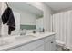 Bathroom featuring double sinks, modern fixtures and vanity with granite countertops at 8673 Laurelton Pl, Brownsburg, IN 46112