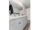 Bathroom featuring double sinks, modern fixtures and vanity with granite countertops at 8673 Laurelton Pl, Brownsburg, IN 46112