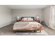 Comfortable bedroom with neutral colors, carpet, and stylish bedside tables at 8673 Laurelton Pl, Brownsburg, IN 46112