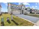 An exterior elevation showcasing a modern two-story home with a two-car garage, manicured lawn, and inviting curb appeal at 8673 Laurelton Pl, Brownsburg, IN 46112
