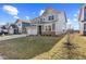 Suburban home showing a manicured lawn and inviting architecture, blending modern design with neighborhood charm at 8673 Laurelton Pl, Brownsburg, IN 46112