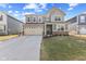 Charming two-story home featuring a two-car garage and welcoming front lawn, in a modern neighborhood at 8673 Laurelton Pl, Brownsburg, IN 46112