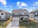 Beautiful two-story home with attached garage, complemented by lush green lawns under a bright sky at 8673 Laurelton Pl, Brownsburg, IN 46112