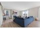 Bright living room featuring a fireplace, comfortable seating, and natural light from the windows at 8673 Laurelton Pl, Brownsburg, IN 46112