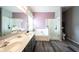 Bathroom featuring a double vanity, soaking tub, glass shower, and neutral wall colors at 8748 N Autumnview Dr, McCordsville, IN 46055