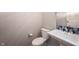 Powder room featuring pedestal sink, blue tile accent and neutral color scheme at 8748 N Autumnview Dr, McCordsville, IN 46055