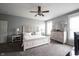 Spacious bedroom with neutral color scheme, ceiling fan, and light wood furniture set at 8748 N Autumnview Dr, McCordsville, IN 46055