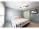 Bedroom with gray walls, window, closet, ceiling fan, and an area rug at 8748 N Autumnview Dr, McCordsville, IN 46055