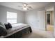 Neutral bedroom offering natural light and a ceiling fan, providing a comfortable and bright space at 8748 N Autumnview Dr, McCordsville, IN 46055