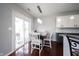 Bright dining area with white table set and sliding glass door at 8748 N Autumnview Dr, McCordsville, IN 46055
