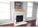Bright and airy fireplace with beautiful mantle and tile surround at 8748 N Autumnview Dr, McCordsville, IN 46055
