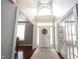 Inviting foyer with high ceilings, a decorative wreath on the front door, and hardwood flooring at 8748 N Autumnview Dr, McCordsville, IN 46055