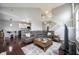 Spacious living room with hardwood floors and stairs at 8748 N Autumnview Dr, McCordsville, IN 46055
