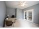 Cozy office with neutral decor, a ceiling fan, and French doors leading to another room at 8748 N Autumnview Dr, McCordsville, IN 46055