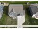 Birds eye view of the home showing its roof and yard with the neighboring homes nearby at 9207 Foudray N Cir, Avon, IN 46123