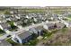 Aerial view of a neighborhood featuring homes with a mix of architectural styles, colors, and manicured lawns at 9207 Foudray N Cir, Avon, IN 46123