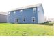 Exterior of home with blue siding, back yard and sliding glass doors at 9207 Foudray N Cir, Avon, IN 46123