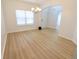 Dining room with wood floors, a chandelier, and ample natural light, perfect for gatherings at 9207 Foudray N Cir, Avon, IN 46123