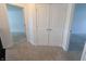 Hallway featuring neutral carpet, with doorways leading to other rooms in the house at 9207 Foudray N Cir, Avon, IN 46123