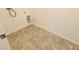 Laundry room with hookups for a washer and dryer and neutral tile floors at 9207 Foudray N Cir, Avon, IN 46123
