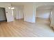 Bright and airy living room with wood-look flooring and large arched doorways at 9207 Foudray N Cir, Avon, IN 46123