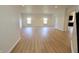 Bright living room with wood floors, recessed lighting, and neutral walls offering a spacious living area at 9207 Foudray N Cir, Avon, IN 46123