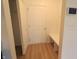 Bright mud room with bench and storage hooks, next to a white door at 9207 Foudray N Cir, Avon, IN 46123