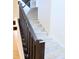 Carpeted staircase with dark wood handrail at 9207 Foudray N Cir, Avon, IN 46123