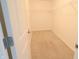 Empty walk-in closet with neutral carpet, wire shelving on all three walls, offering ample storage at 9207 Foudray N Cir, Avon, IN 46123