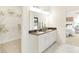 Bright bathroom featuring marble floors, double sink vanity, and a walk-in closet at 9375 Abner St, McCordsville, IN 46055