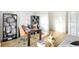 Bright home office space with large window, a stylish desk, and decorative shelving at 9375 Abner St, McCordsville, IN 46055