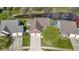 Aerial view of home showcasing landscaping, driveway, and waterway at 9526 Colony Pointe E Dr, Indianapolis, IN 46250