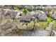 Aerial view of house, waterfront backyard, and neighborhood at 9526 Colony Pointe E Dr, Indianapolis, IN 46250