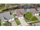 Aerial view of home showcasing the roof, landscaping, and waterway at 9526 Colony Pointe E Dr, Indianapolis, IN 46250