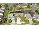 Aerial view of the property, showcasing the roof, yard, nearby pond, and surrounding neighborhood at 9526 Colony Pointe E Dr, Indianapolis, IN 46250