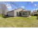Spacious backyard with lush green grass and a view of the house at 9526 Colony Pointe E Dr, Indianapolis, IN 46250
